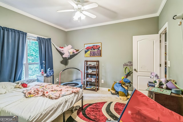 bedroom with carpet floors, ornamental molding, a ceiling fan, and baseboards