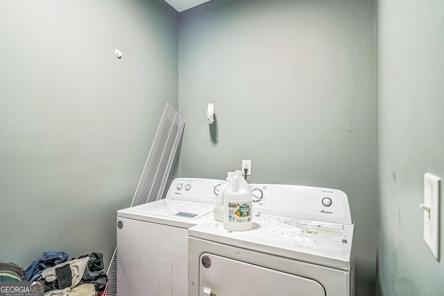 washroom with separate washer and dryer