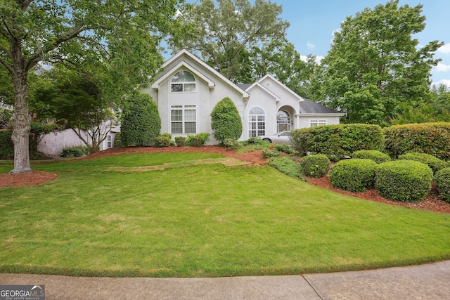 132 Eagles Club Dr, Stockbridge, GA 30281 - view of front of home with a front lawn and stucco siding