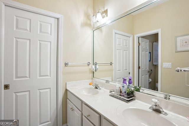 132 Eagles Club Dr, Stockbridge, GA 30281 - bathroom featuring double vanity and toilet