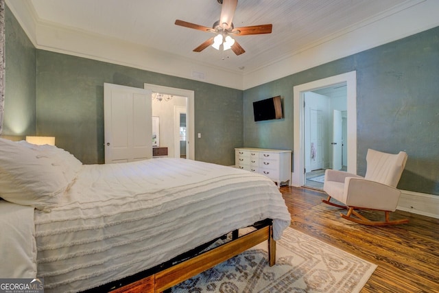 bedroom with wood finished floors, ornamental molding, and a ceiling fan