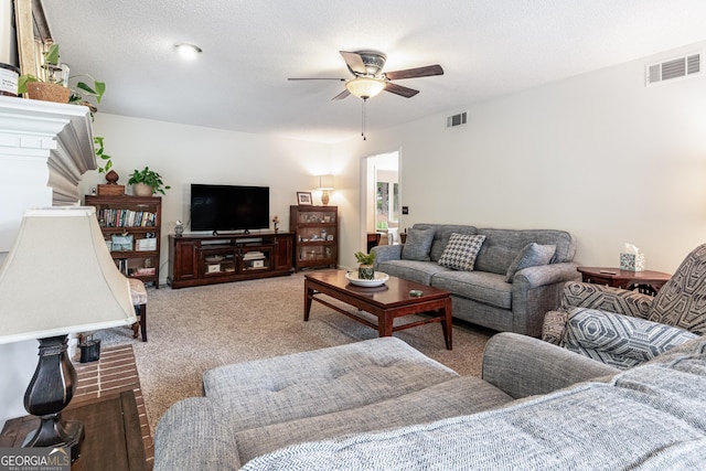 living room with ceiling fan and light colored carpet