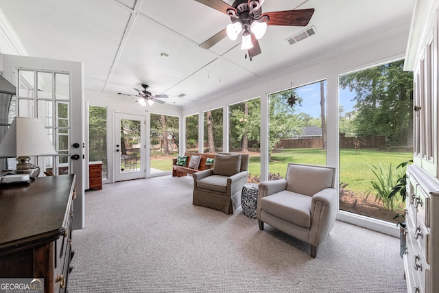 sunroom with a ceiling fan, healthy amount of natural light, and french doors