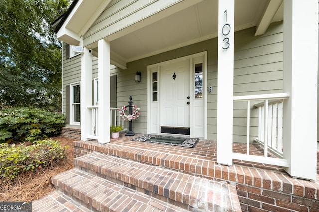 property entrance featuring covered porch