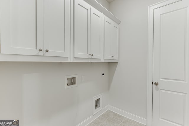 1023 Harvest Park Ln, Suwanee, GA 30024 - clothes washing area featuring cabinet space, electric dryer hookup, baseboards, and washer hookup