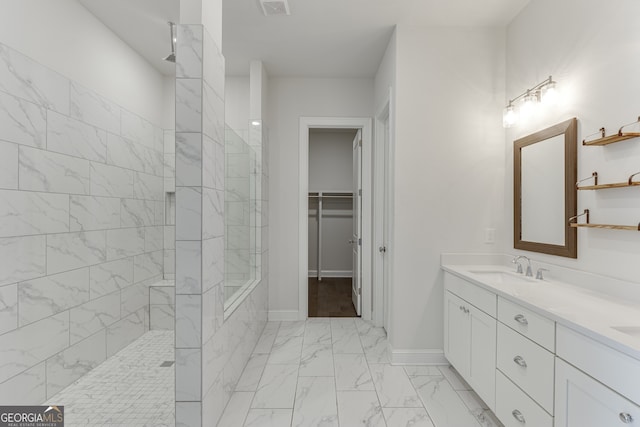 1023 Harvest Park Ln, Suwanee, GA 30024 - bathroom featuring a walk in shower, marble finish floors, a walk in closet, double vanity, and baseboards