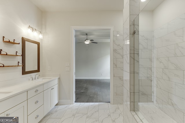 1023 Harvest Park Ln, Suwanee, GA 30024 - full bathroom with a ceiling fan, double vanity, marble look tiles, and baseboards