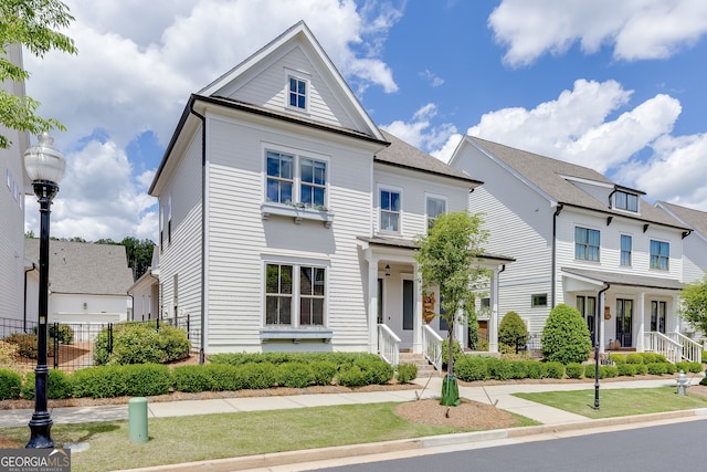1023 Harvest Park Ln, Suwanee, GA 30024 - view of front of home featuring fence and covered porch