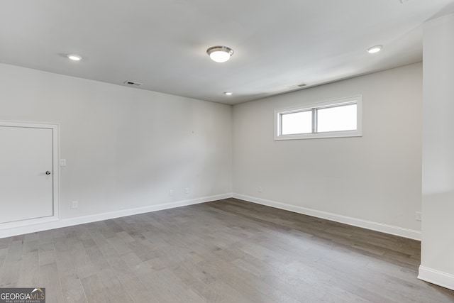 1023 Harvest Park Ln, Suwanee, GA 30024 - unfurnished room with wood finished floors, baseboards, and recessed lighting