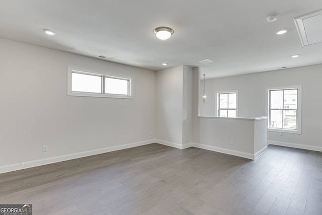 1023 Harvest Park Ln, Suwanee, GA 30024 - empty room featuring baseboards, attic access, dark wood-style floors, recessed lighting, and a smoke detector
