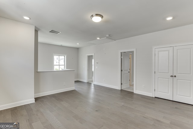1023 Harvest Park Ln, Suwanee, GA 30024 - spare room with attic access, wood finished floors, baseboards, and recessed lighting