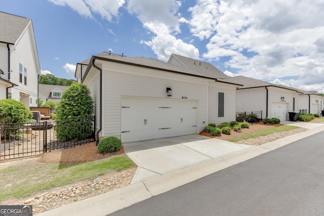 1023 Harvest Park Ln, Suwanee, GA 30024 - view of front of property featuring fence, an attached garage, and driveway