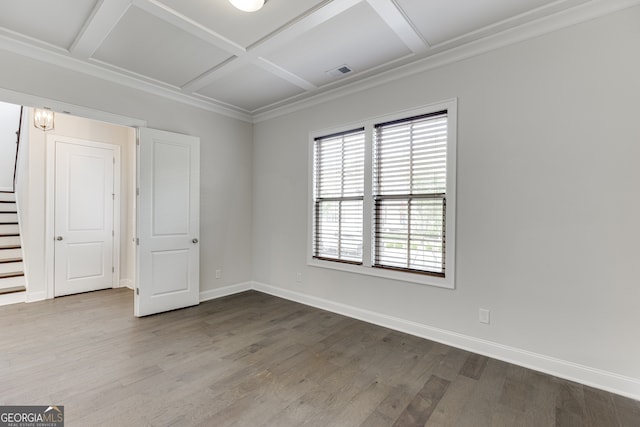 1023 Harvest Park Ln, Suwanee, GA 30024 - spare room featuring coffered ceiling, baseboards, wood finished floors, stairway, and crown molding