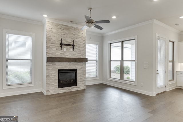 1023 Harvest Park Ln, Suwanee, GA 30024 - unfurnished living room with plenty of natural light, ceiling fan, baseboards, dark wood-style floors, and crown molding