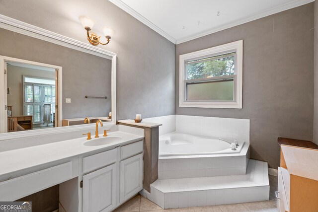 bathroom with vanity, a bath, ornamental molding, and tile patterned flooring