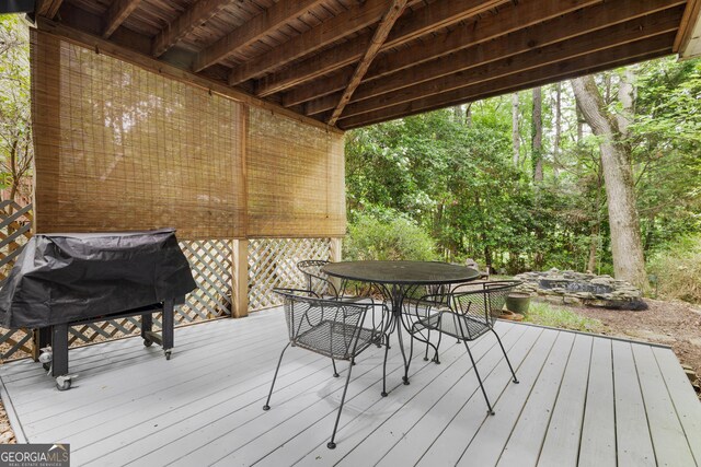 deck featuring outdoor dining area