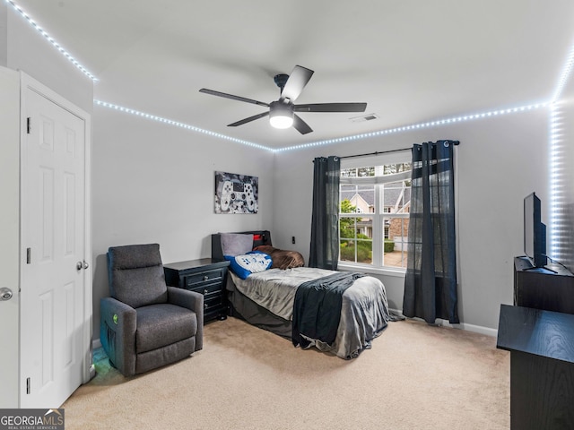 bedroom featuring carpet, a ceiling fan, and baseboards