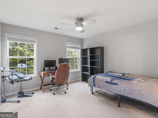 bedroom with carpet floors, a desk, baseboards, and ceiling fan