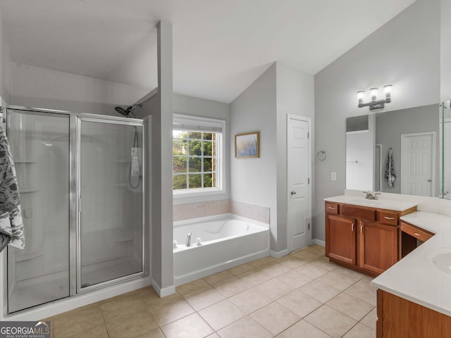973 Buckhorn Bnd, Locust Grove, GA 30248 - full bath with a shower stall, vaulted ceiling, vanity, a garden tub, and tile patterned floors