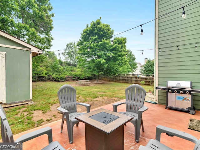 973 Buckhorn Bnd, Locust Grove, GA 30248 - view of patio / terrace featuring a fire pit, a grill, an outdoor structure, and a shed