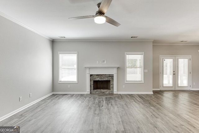 9565 Rushmore Cir, Braselton, GA 30517 - unfurnished living room with a ceiling fan, wood finished floors, a fireplace, crown molding, and baseboards