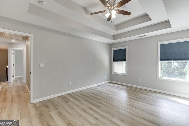 9565 Rushmore Cir, Braselton, GA 30517 - unfurnished room with a tray ceiling, attic access, a ceiling fan, a smoke detector, and healthy amount of natural light