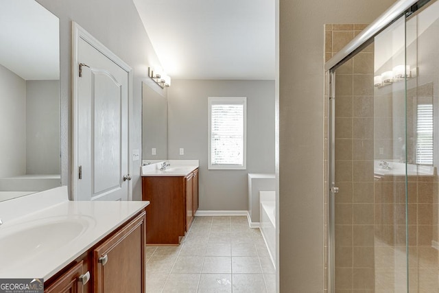 9565 Rushmore Cir, Braselton, GA 30517 - bathroom with a shower stall, two vanities, tile patterned floors, and baseboards