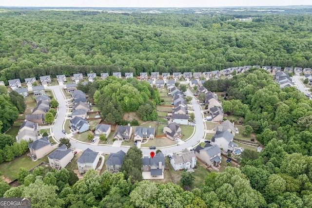 9565 Rushmore Cir, Braselton, GA 30517 - aerial view of property's location featuring a heavily wooded area and nearby suburban area