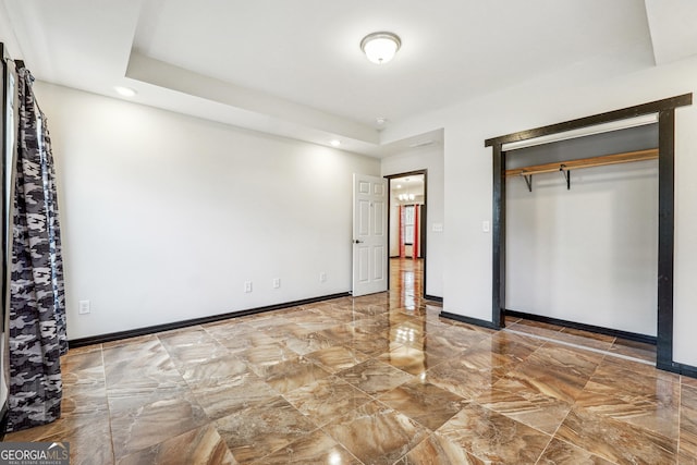 unfurnished bedroom with recessed lighting, a closet, and baseboards