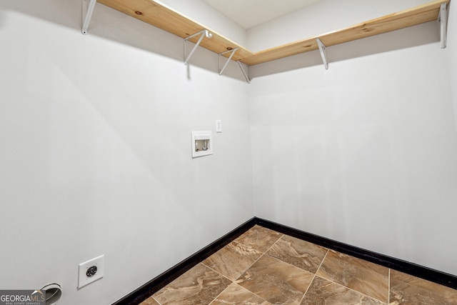 clothes washing area with washer hookup, hookup for an electric dryer, and baseboards