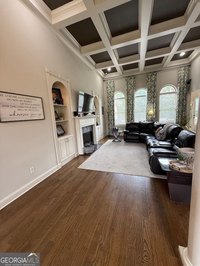 142 Oak Grove Path, Griffin, GA 30224 - living area with plenty of natural light, coffered ceiling, dark wood-type flooring, a fireplace, and beam ceiling
