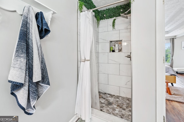 2349 June Springs Dr SW, Marietta, GA 30008 - full bathroom with a tile shower and wood finished floors