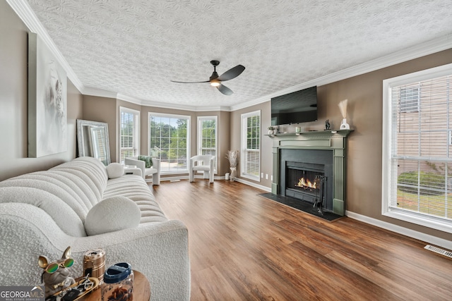 2349 June Springs Dr SW, Marietta, GA 30008 - living room with ceiling fan, wood finished floors, baseboards, a fireplace with flush hearth, and ornamental molding