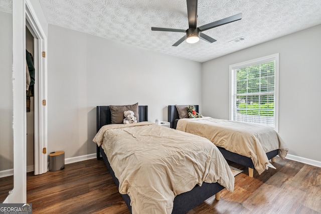 2349 June Springs Dr SW, Marietta, GA 30008 - bedroom featuring dark wood-type flooring, baseboards, a textured ceiling, and a ceiling fan