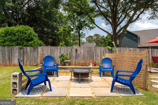 2349 June Springs Dr SW, Marietta, GA 30008 - fenced backyard featuring a fire pit and a patio