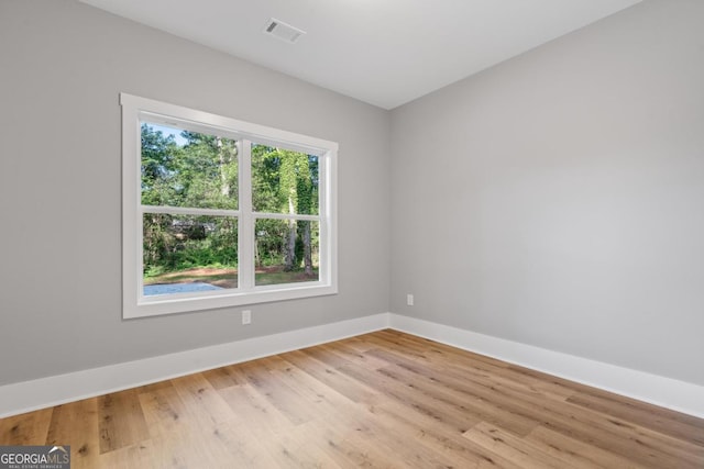 103 Spruce Ln, Eatonton, GA 31024 - spare room with baseboards and light wood-style floors