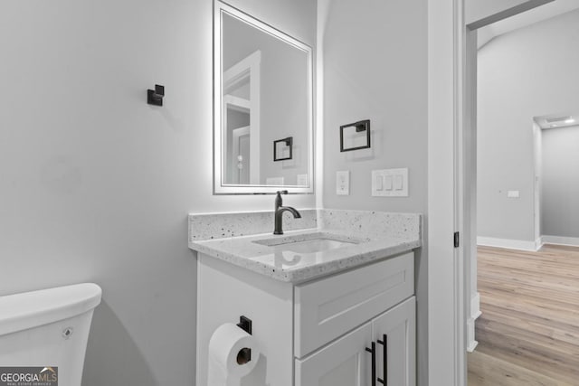 103 Spruce Ln, Eatonton, GA 31024 - half bath with vanity and wood finished floors