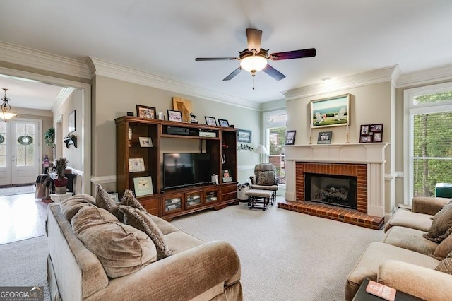 7511 Biltmore Ln, Douglasville, GA 30135 - carpeted living room with crown molding, ceiling fan, a fireplace, and a wainscoted wall