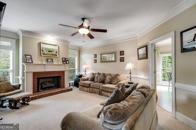 7511 Biltmore Ln, Douglasville, GA 30135 - living area with carpet, ceiling fan, healthy amount of natural light, ornamental molding, and a fireplace
