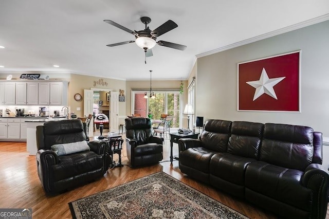 7511 Biltmore Ln, Douglasville, GA 30135 - living room featuring ornamental molding, a ceiling fan, light wood-style flooring, and recessed lighting