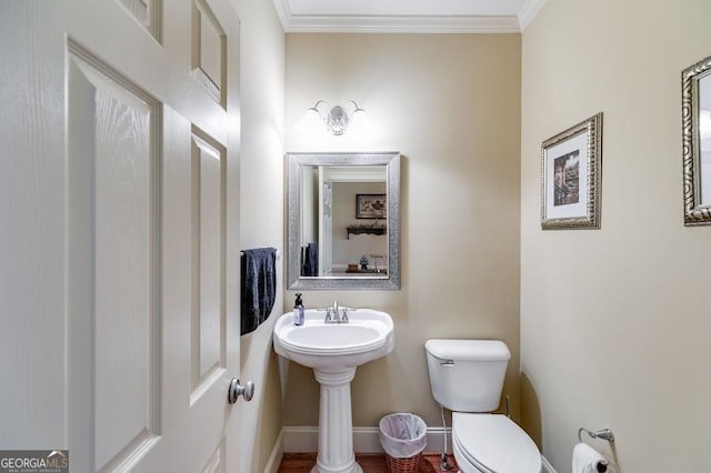 7511 Biltmore Ln, Douglasville, GA 30135 - half bath with toilet, ornamental molding, baseboards, and a sink