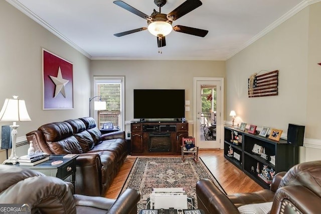 7511 Biltmore Ln, Douglasville, GA 30135 - living room featuring wood finished floors, plenty of natural light, ceiling fan, and ornamental molding