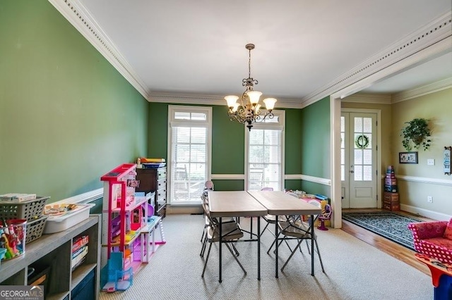 7511 Biltmore Ln, Douglasville, GA 30135 - dining room featuring a chandelier, ornamental molding, and baseboards