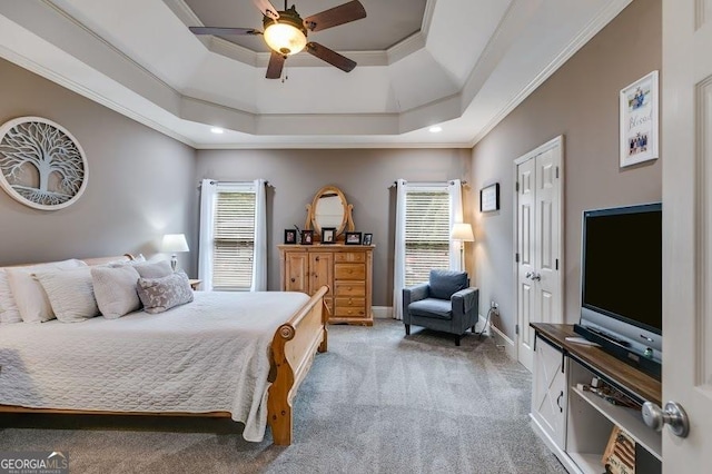 7511 Biltmore Ln, Douglasville, GA 30135 - bedroom with multiple windows, light carpet, a tray ceiling, ornamental molding, and a ceiling fan