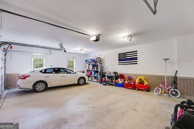 7511 Biltmore Ln, Douglasville, GA 30135 - garage with a garage door opener and wainscoting