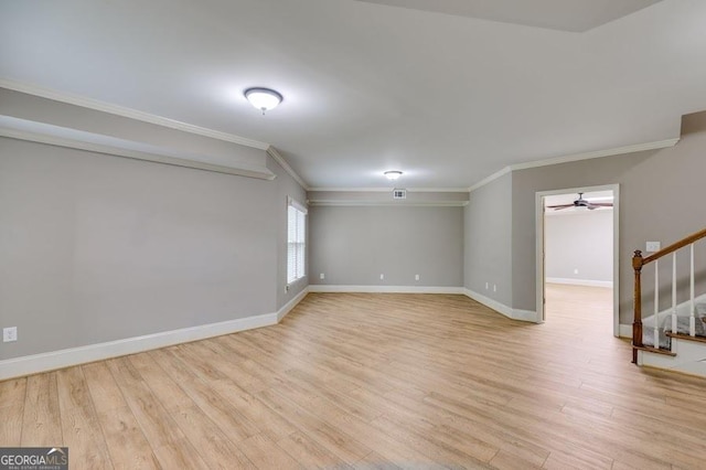 7511 Biltmore Ln, Douglasville, GA 30135 - empty room featuring ornamental molding, stairs, light wood-style floors, baseboards, and a ceiling fan