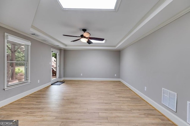 7511 Biltmore Ln, Douglasville, GA 30135 - unfurnished room with a raised ceiling, ornamental molding, ceiling fan, light wood-style floors, and baseboards
