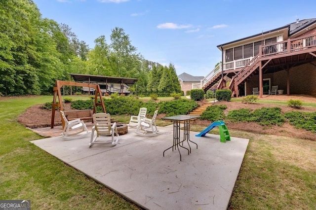 7511 Biltmore Ln, Douglasville, GA 30135 - view of patio with stairway, a fire pit, and a wooden deck