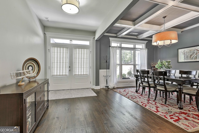 dining space featuring french doors, dark wood-style floors, beamed ceiling, and coffered ceiling