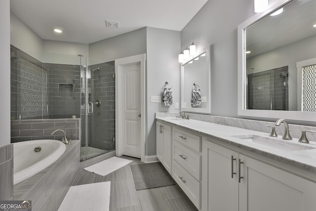 full bathroom with a stall shower, double vanity, a bath, recessed lighting, and tile patterned floors